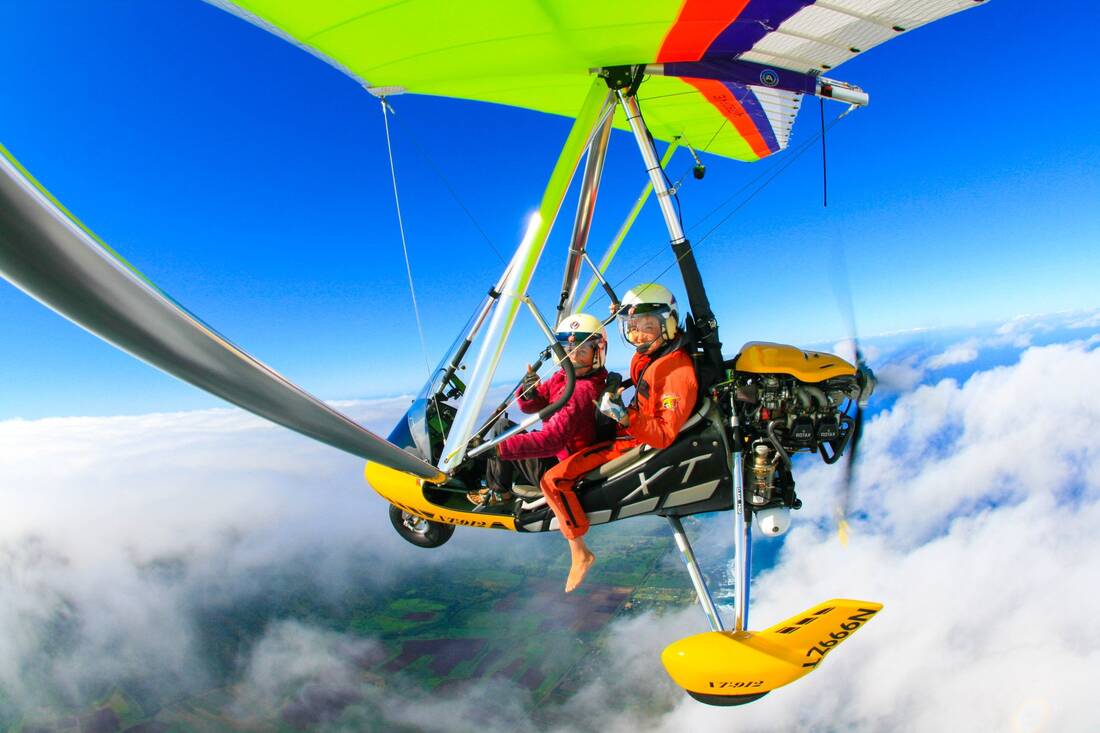 Two aboard the trike above a layer of cloud
